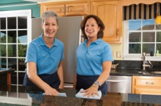 Two Woman Cleaning The Kitchen
